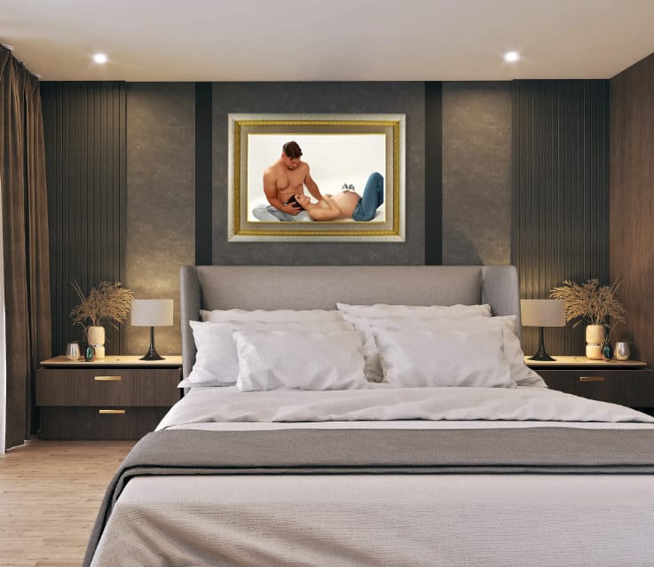 Luxurious, dark-toned bedroom with a gray bed and nightstands, featuring a large framed portrait above the headboard.